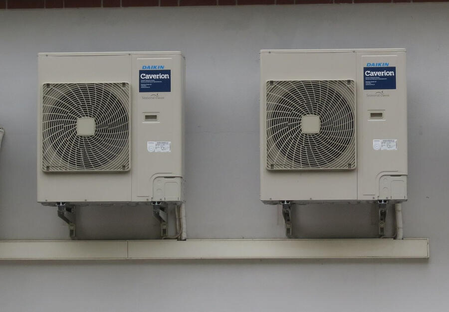 Two Daikin outdoor units neatly wall-mounted on brackets